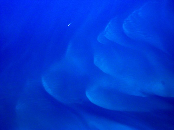 Underwater sand formations and a passing speed boat make a perfect composition, all from 20,000 feet in the air just off the coast of South Florida.