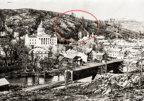 Hubbard Park, sans trees, is seen behind the Vermont State House in this photograph dated 1874