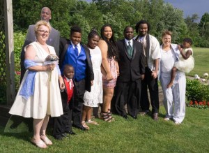 Jack appears in this family portrait as a cardboard cutout of himself because he could not attend in person.