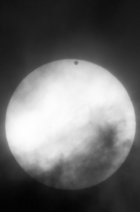 The planet Venus is a small black dot as it crosses in front of the Sun. This transit is an important reminder to me of our place in the universe.